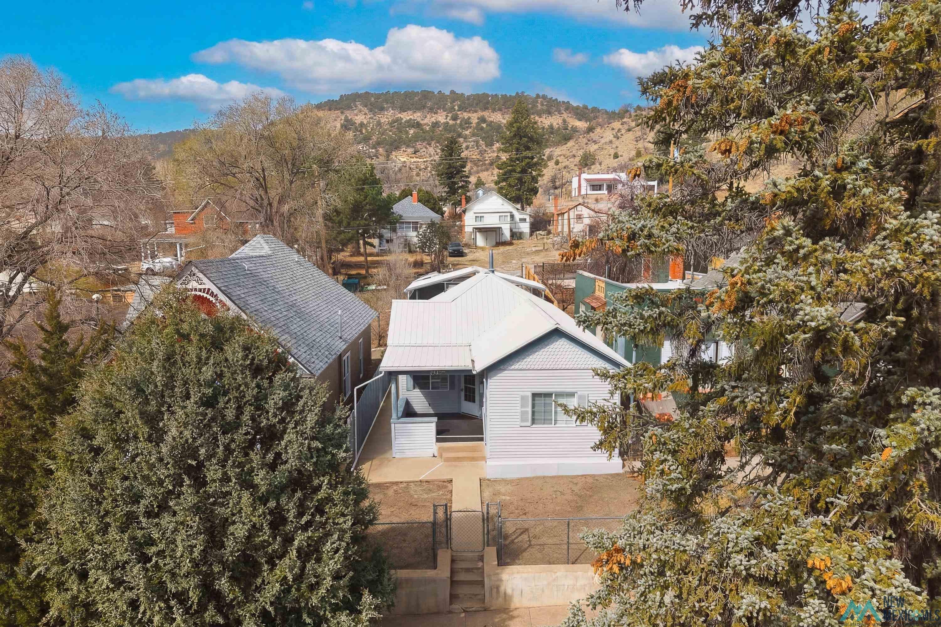 120 South 5th Street Raton, NM 87740 - Photo 2 of 25 Aerial perspective of suburban area featuring a mountainous background