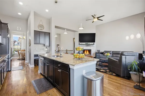 a kitchen with a sink appliances and cabinets