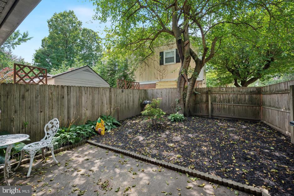 449 West School House Lane Philadelphia, PA 19144 - Photo 13 of 13 a view of a backyard with plants and a large tree