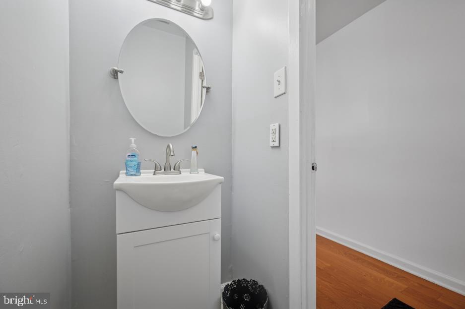 449 West School House Lane Philadelphia, PA 19144 - Photo 2 of 13 a bathroom with a sink a mirror and vanity