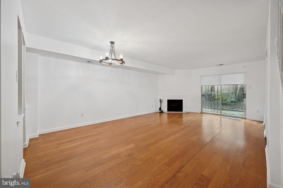 449 West School House Lane Philadelphia, PA 19144 - Photo 4 of 13 an empty room with wooden floor and windows