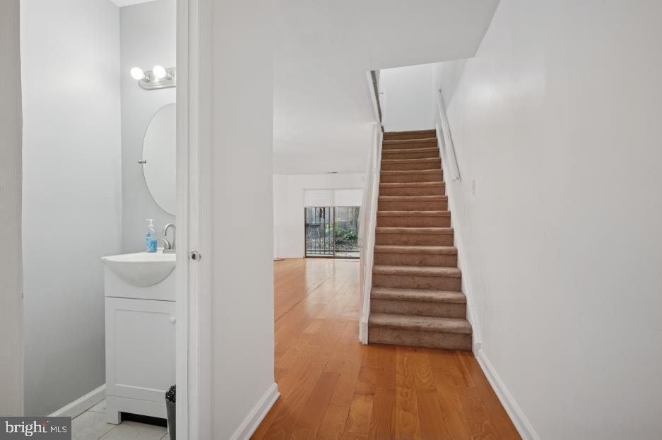 449 West School House Lane Philadelphia, PA 19144 - Photo 6 of 13 a view of a hallway with wooden floor and entryway