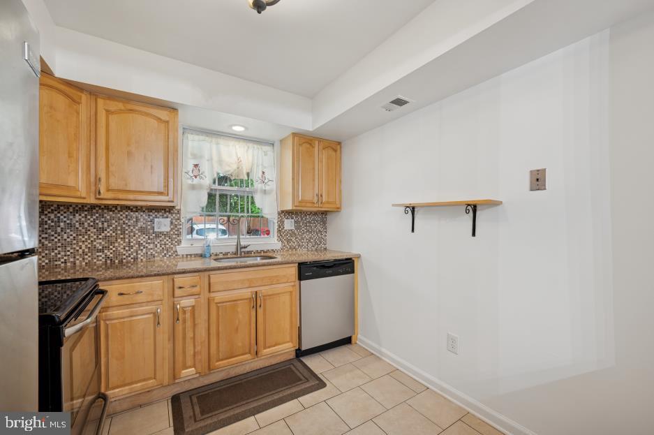 449 West School House Lane Philadelphia, PA 19144 - Photo 7 of 13 a kitchen with a sink cabinets and window