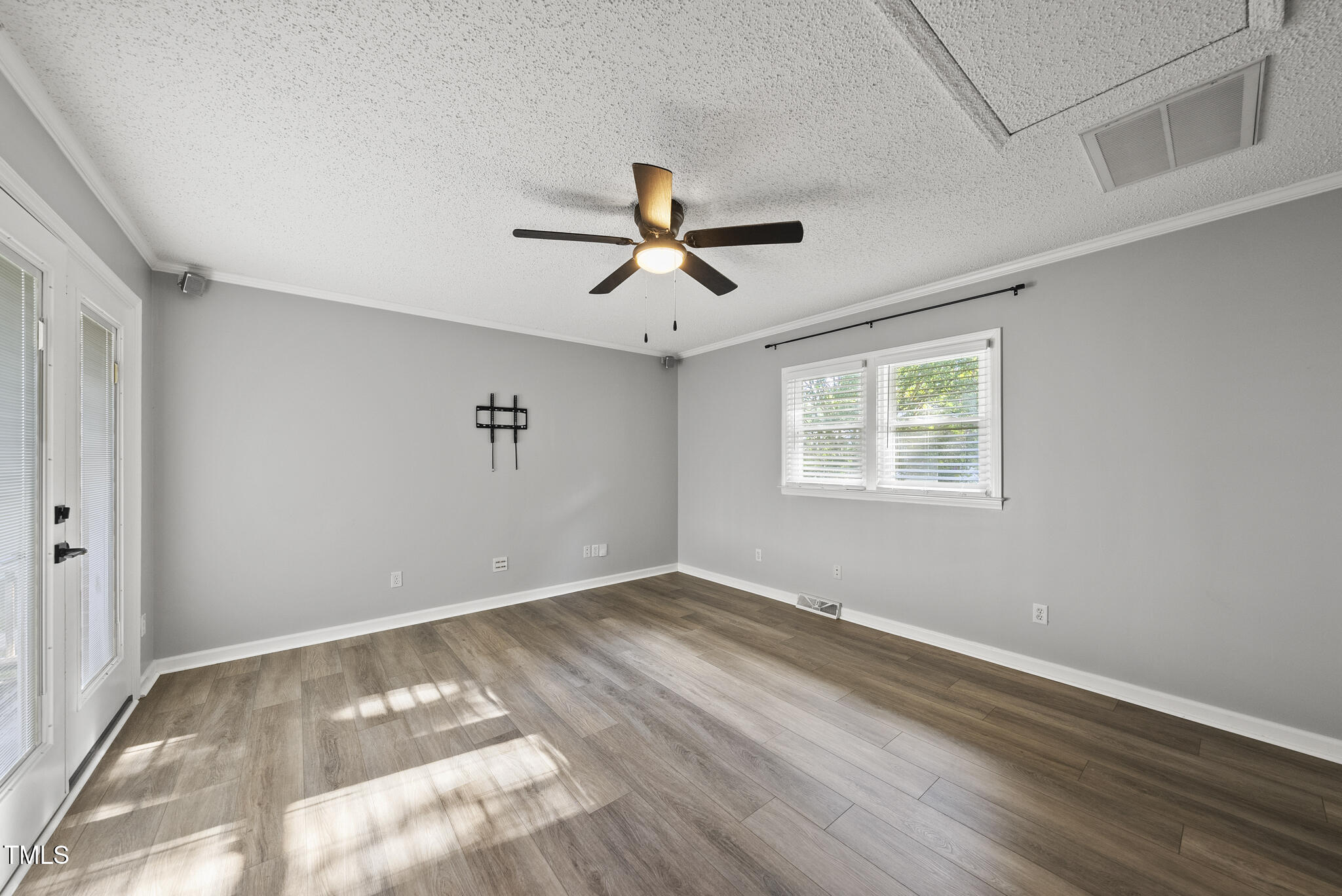 4500 Castlebar Drive Raleigh, NC 27604 - Photo 23 of 36 wooden floor in an empty room with a window