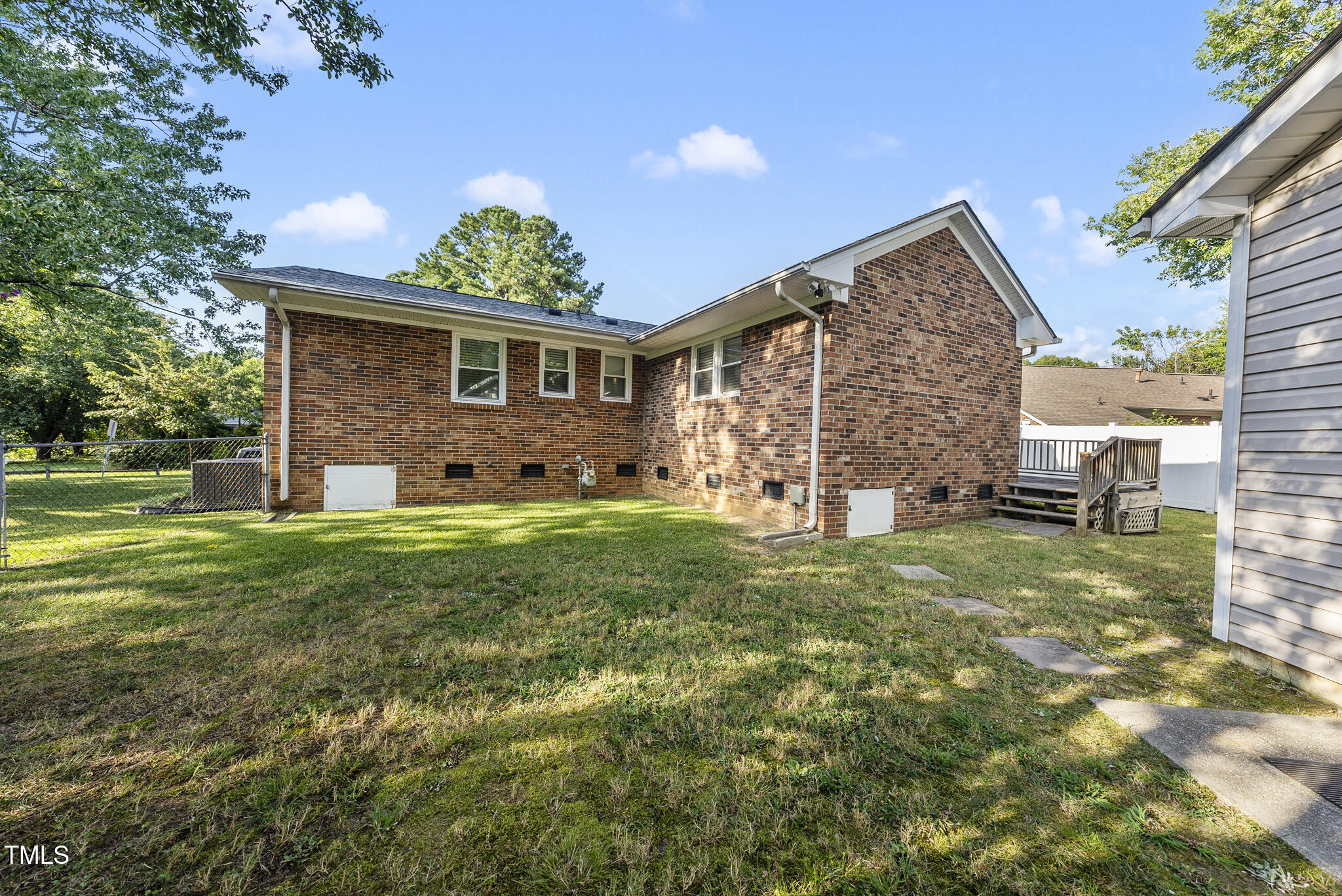 4500 Castlebar Drive Raleigh, NC 27604 - Photo 27 of 36 a view of a yard in front of a house with plants and large tree