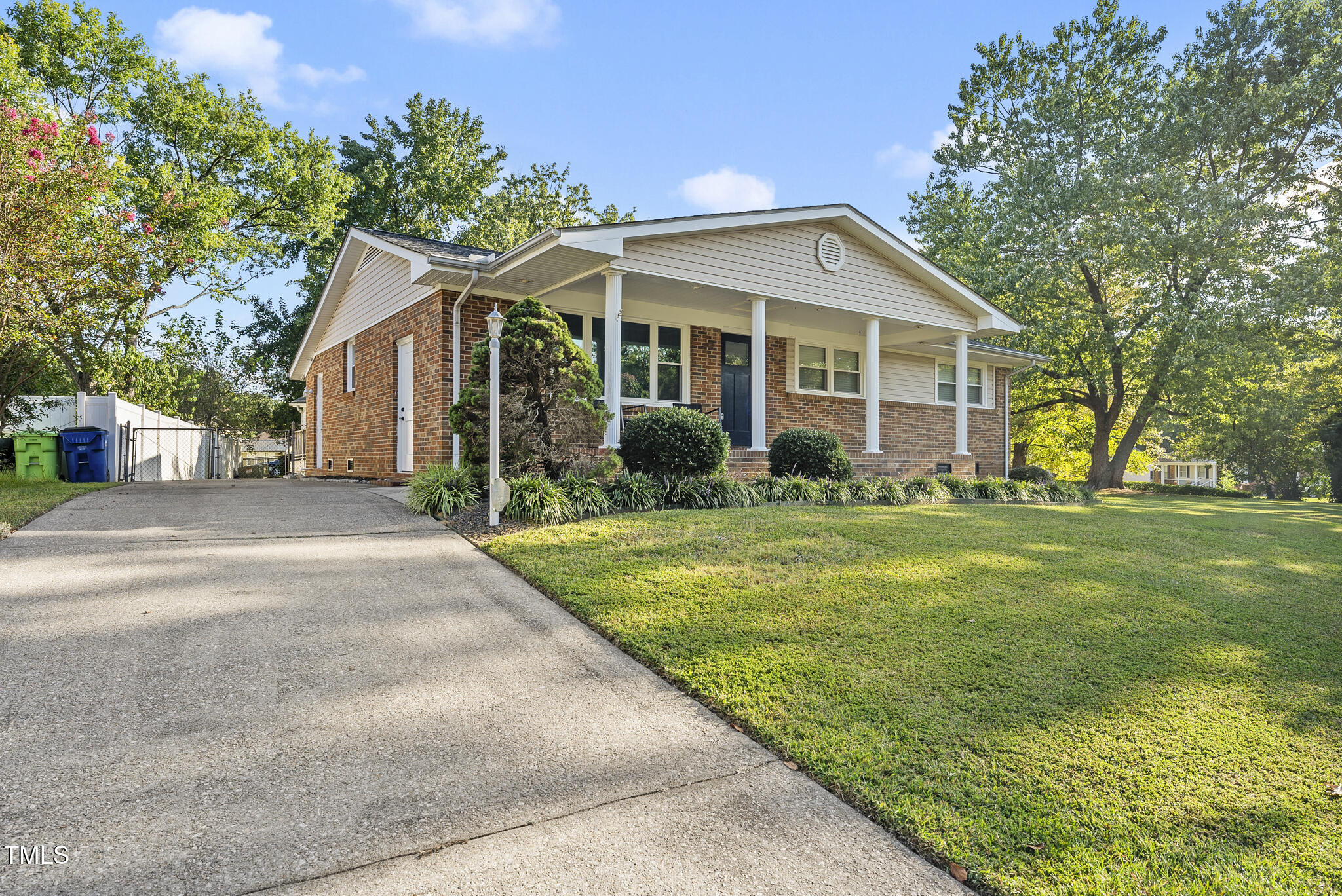 4500 Castlebar Drive Raleigh, NC 27604 - Photo 4 of 36 a front view of a house with a yard and garage