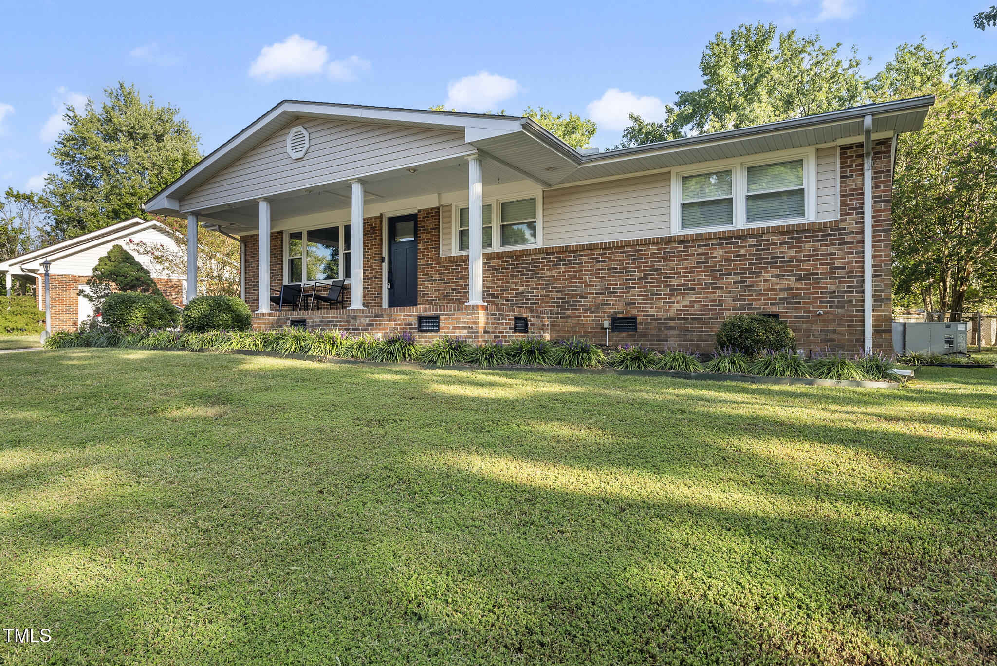 4500 Castlebar Drive Raleigh, NC 27604 - Photo 5 of 36 a view of a house with a yard and sitting area