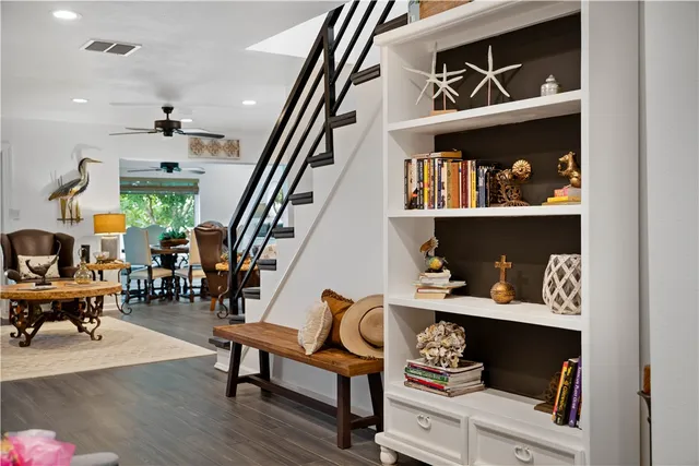 a living room with lots of furniture and baby wooden floors
