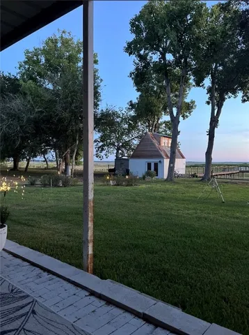a view of backyard with green space