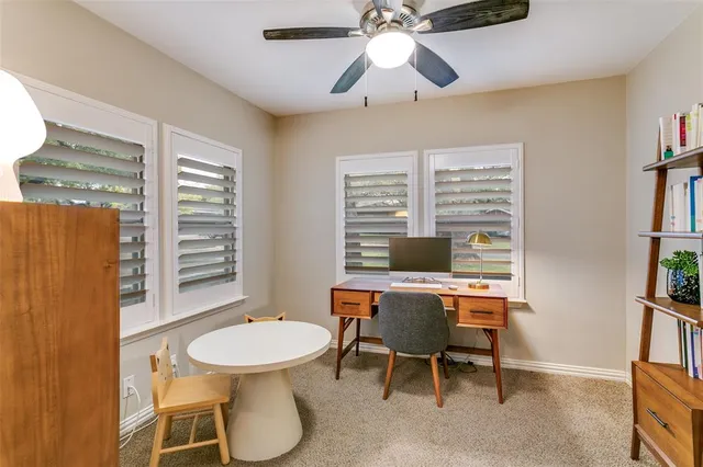 a workspace with furniture and a window