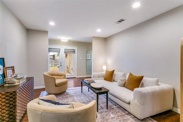a living room with furniture and a table