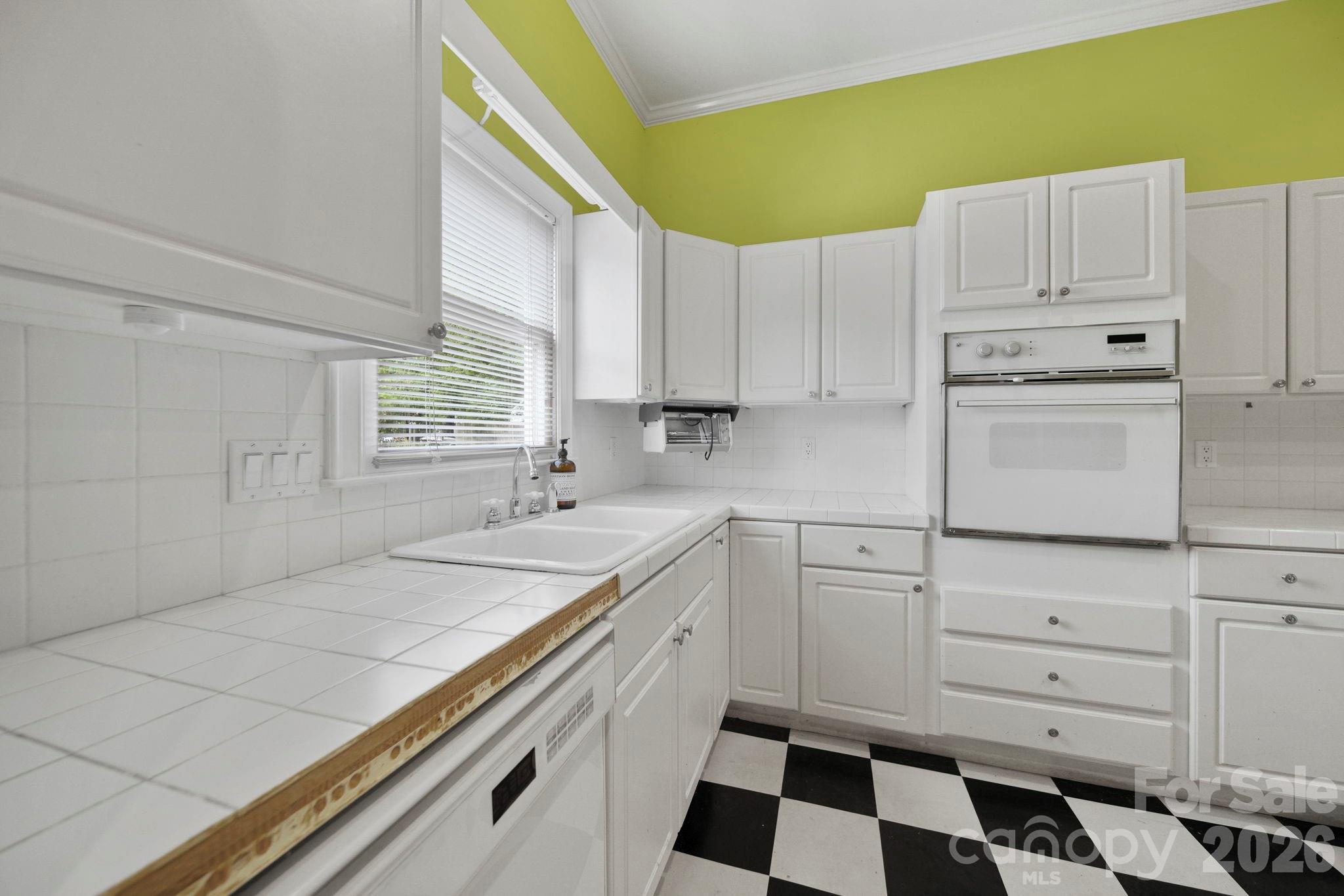 1109 Union Road Gastonia, NC 28054 - Photo 29 of 44 a kitchen with white cabinets and appliances