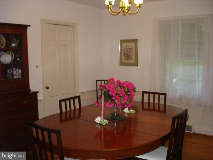 535 Valley View Road Towson, MD 21286 - Photo 3 of 24 Formal dining room w/hdwd, chair rail & wainscotng