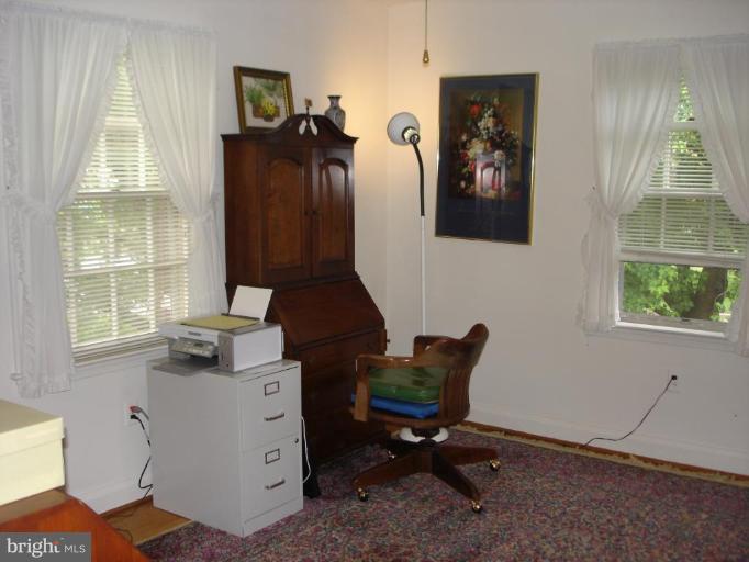 535 Valley View Road Towson, MD 21286 - Photo 9 of 24 1st floor bedroom w/ceiling fan & hardwood floor