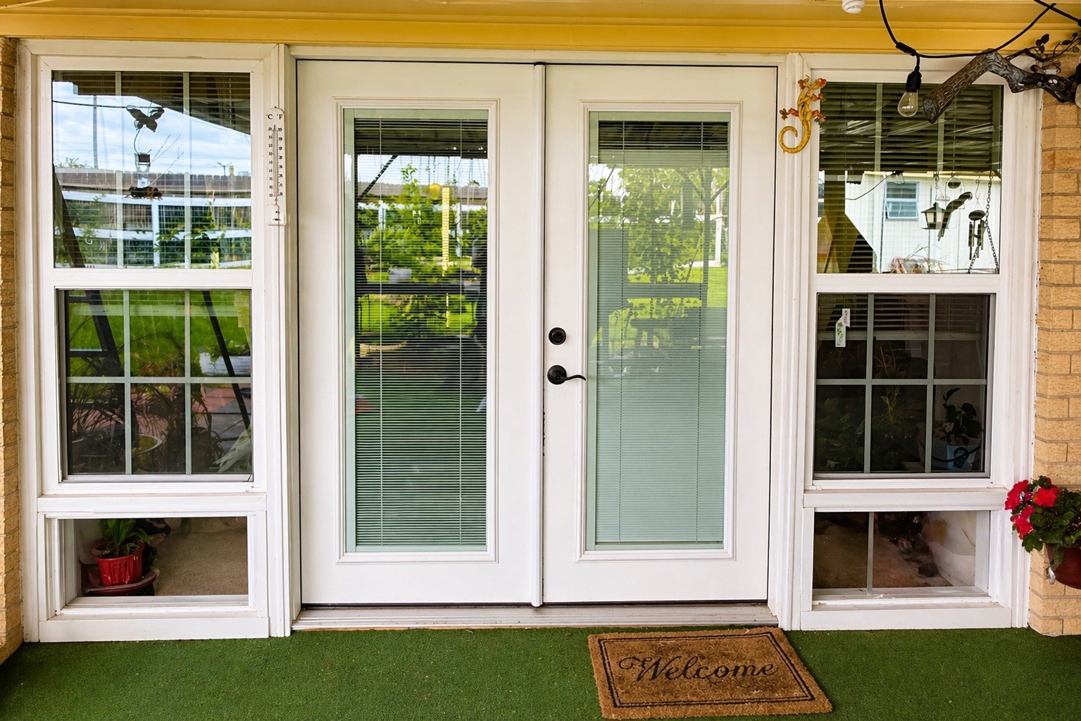 206 Riverside Street Highlands, TX 77562 - Photo 9 of 12 Stunning French doors with full length glass panels open seamlessly to the backyard, flooding the home with natural light and creating an effortless indoor outdoor connection.
