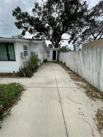 a front view of a house with a yard and a garage