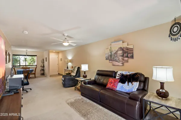 a livingroom with workspace window and a couch