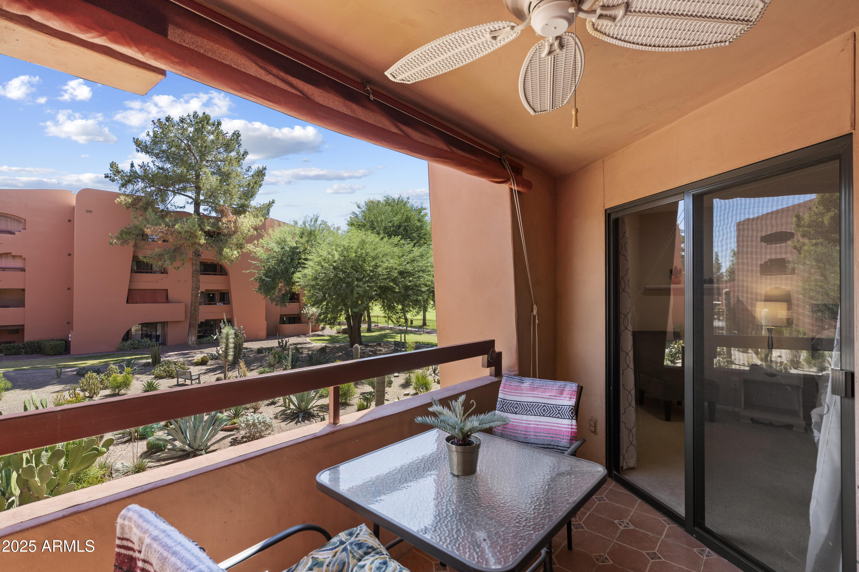 4303 East Cactus Road, Unit 222 Phoenix, AZ 85032 - Photo 20 of 38 a view of a balcony with chairs