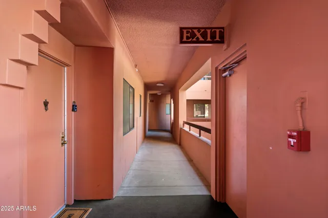 a view of a balcony with chairs