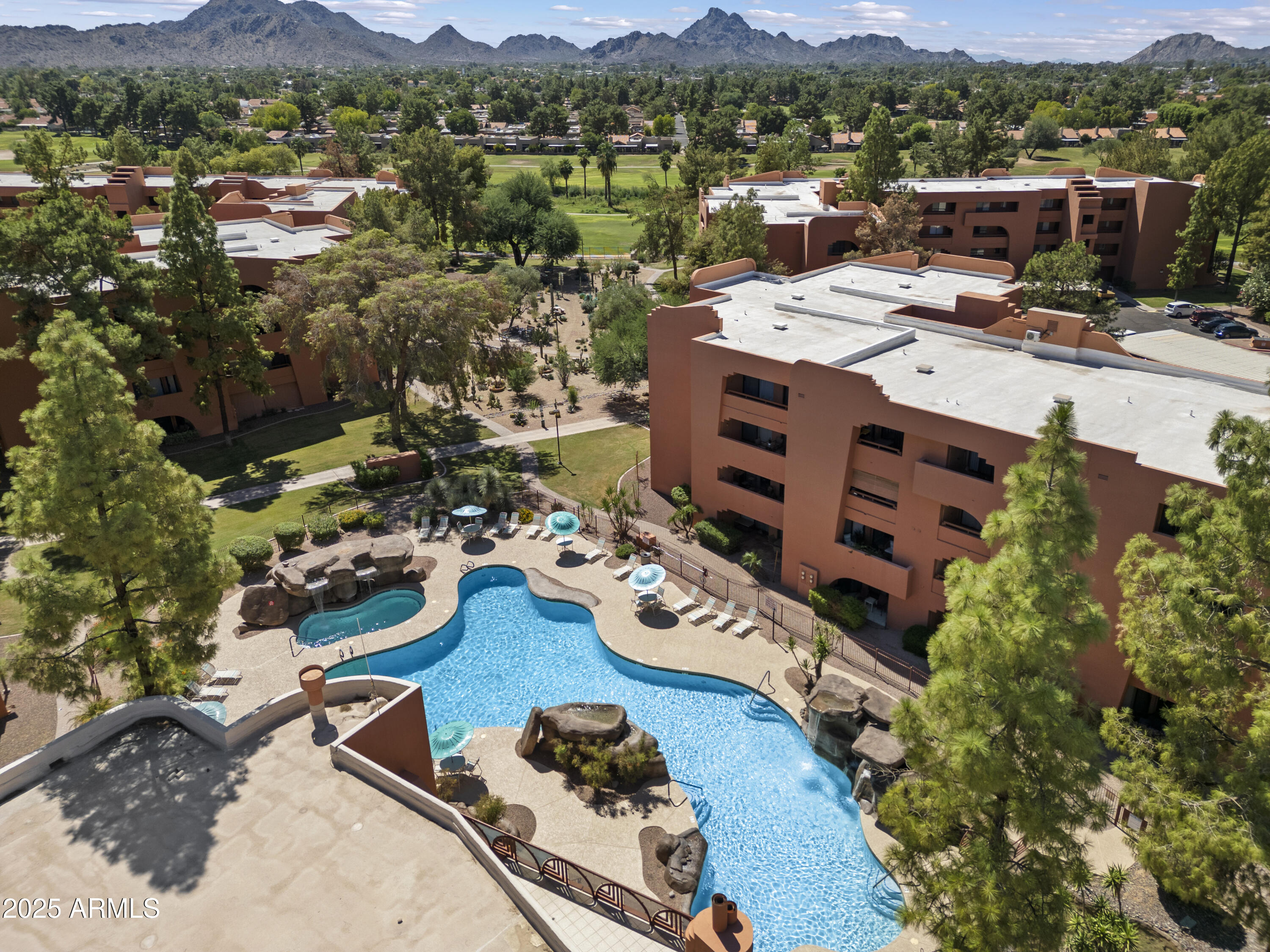 4303 East Cactus Road, Unit 222 Phoenix, AZ 85032 - Photo 25 of 38 an aerial view of a house with yard kitchen and mountain view