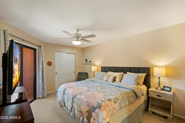 a kitchen with a refrigerator a stove top oven a sink dishwasher and a dining table with wooden floor