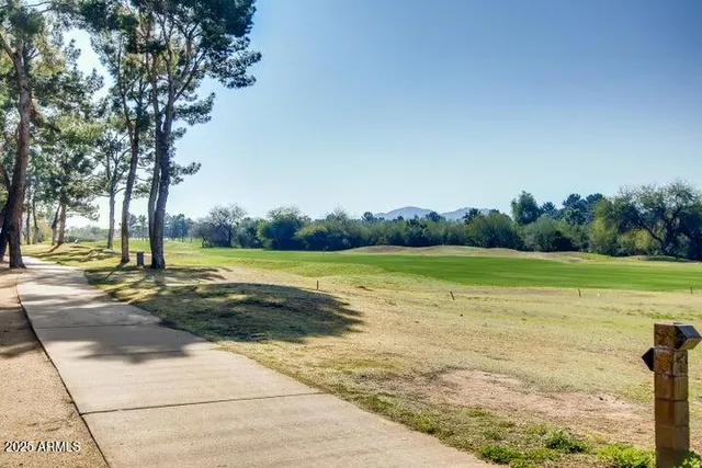 a view of a house with a yard and a garden
