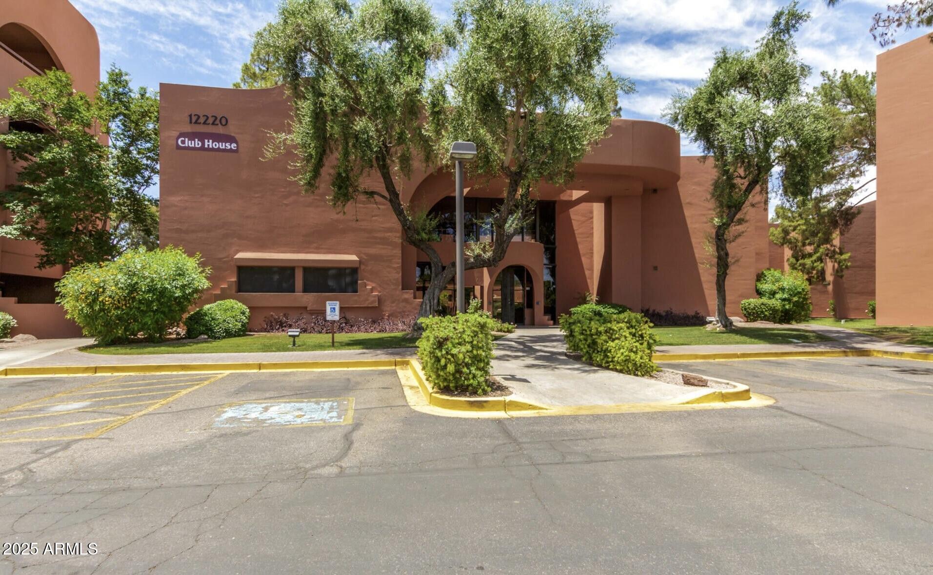 4303 East Cactus Road, Unit 222 Phoenix, AZ 85032 - Photo 34 of 38 front view of a house with a yard