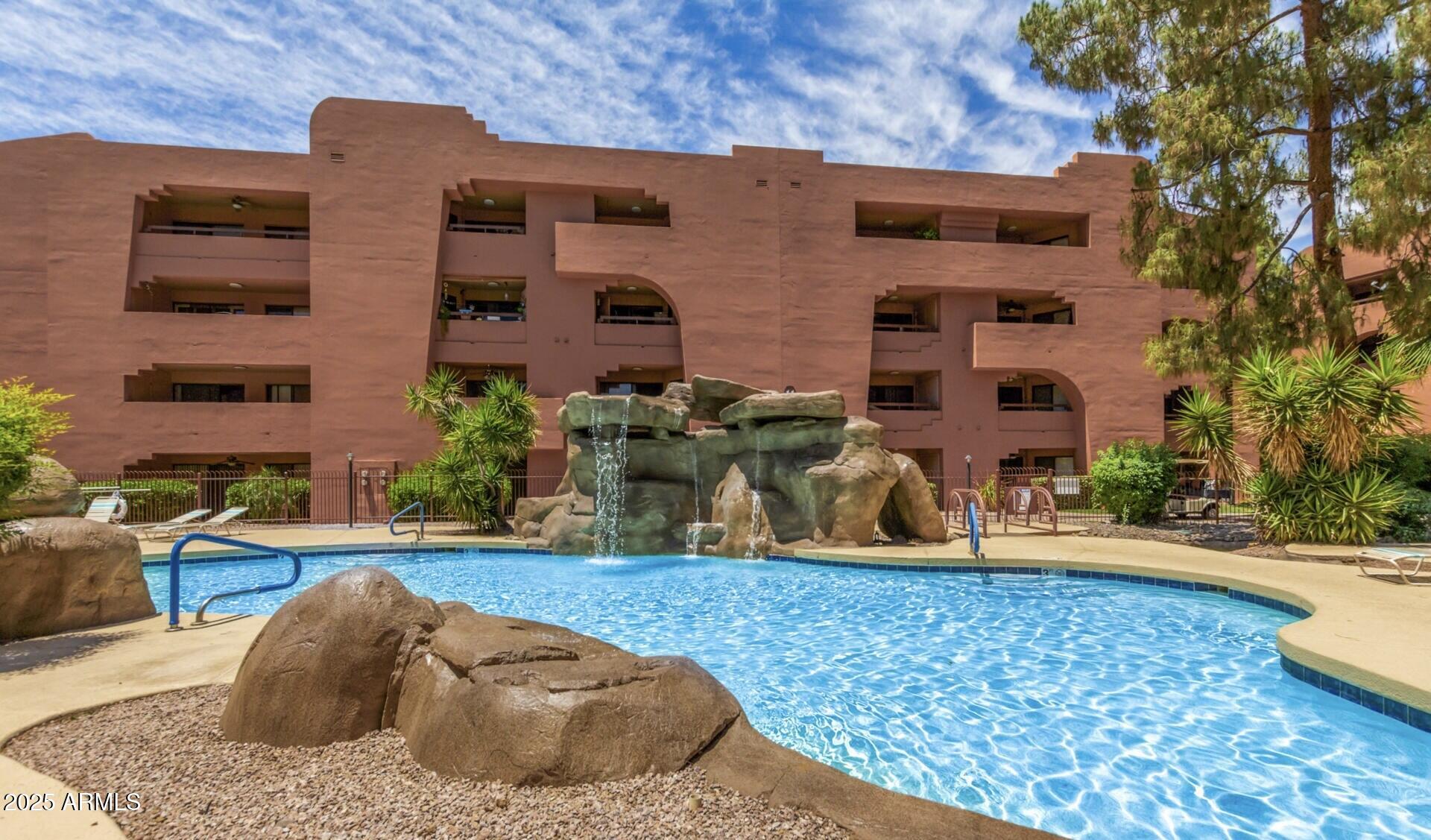 4303 East Cactus Road, Unit 222 Phoenix, AZ 85032 - Photo 4 of 38 a backyard of a house with outdoor seating