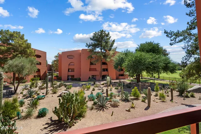 a backyard of a house with outdoor seating