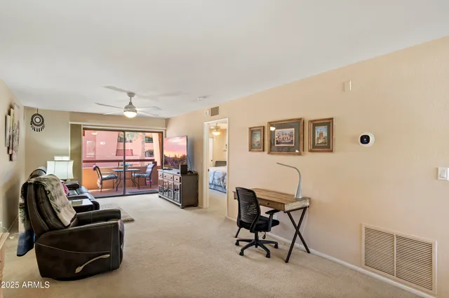 a bedroom with furniture and a window