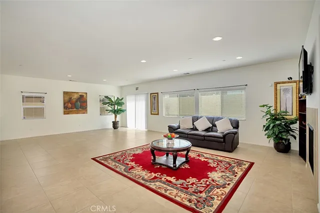 a living room with furniture rug and window