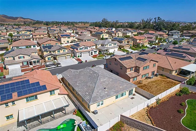 an aerial view of residential houses with outdoor space