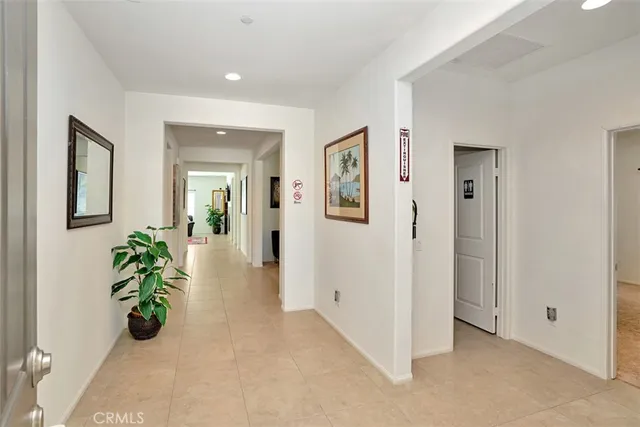 wooden floor in a hall with a glass door and furniture
