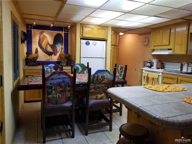 a dinning table and chairs in a room
