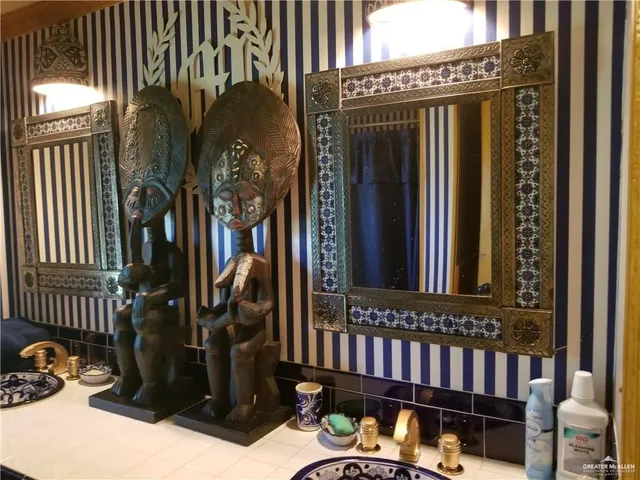 a view of a house with a small yard and furniture