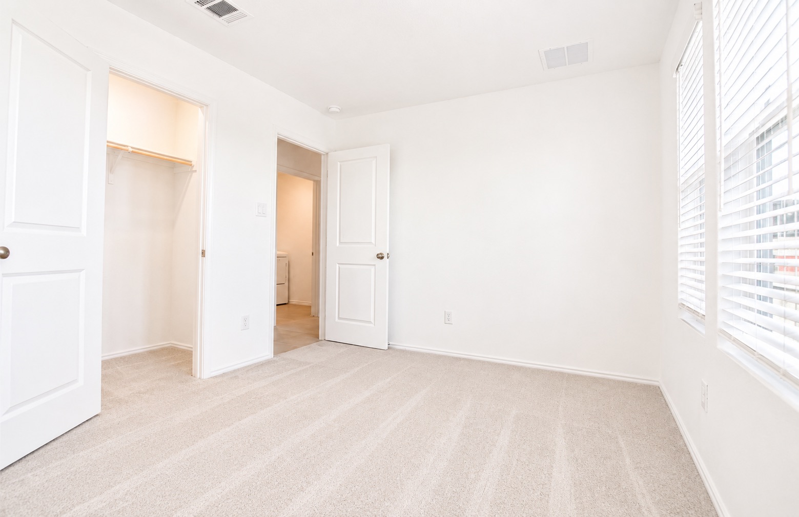 397 Keefer Kyle, TX 78640 - Photo 26 of 33 A well-lit bedroom features plush carpeting and a convenient walk-in closet.
