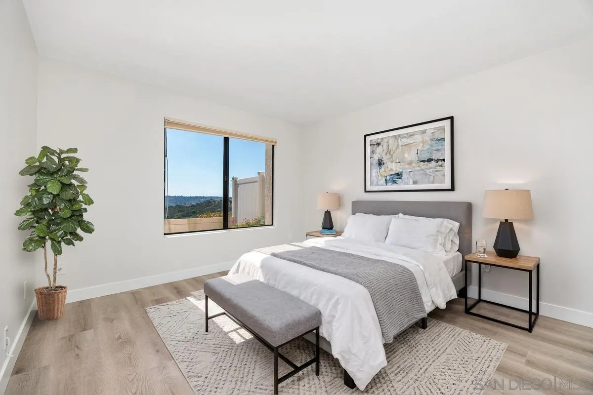 245 Fairlee Lane Encinitas, CA 92024 - Photo 2 of 18 a bedroom with a bed and a window