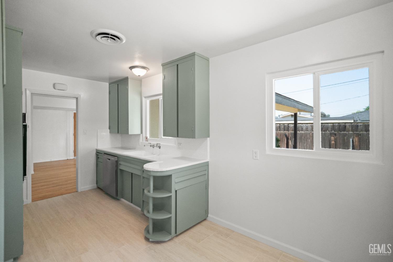 Undisclosed Address Bakersfield, CA 93304 - Photo 21 of 41 a bathroom with a double vanity sink and a mirror