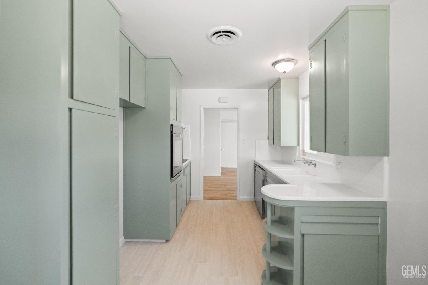 Undisclosed Address Bakersfield, CA 93304 - Photo 22 of 41 a bathroom with a sink and a mirror