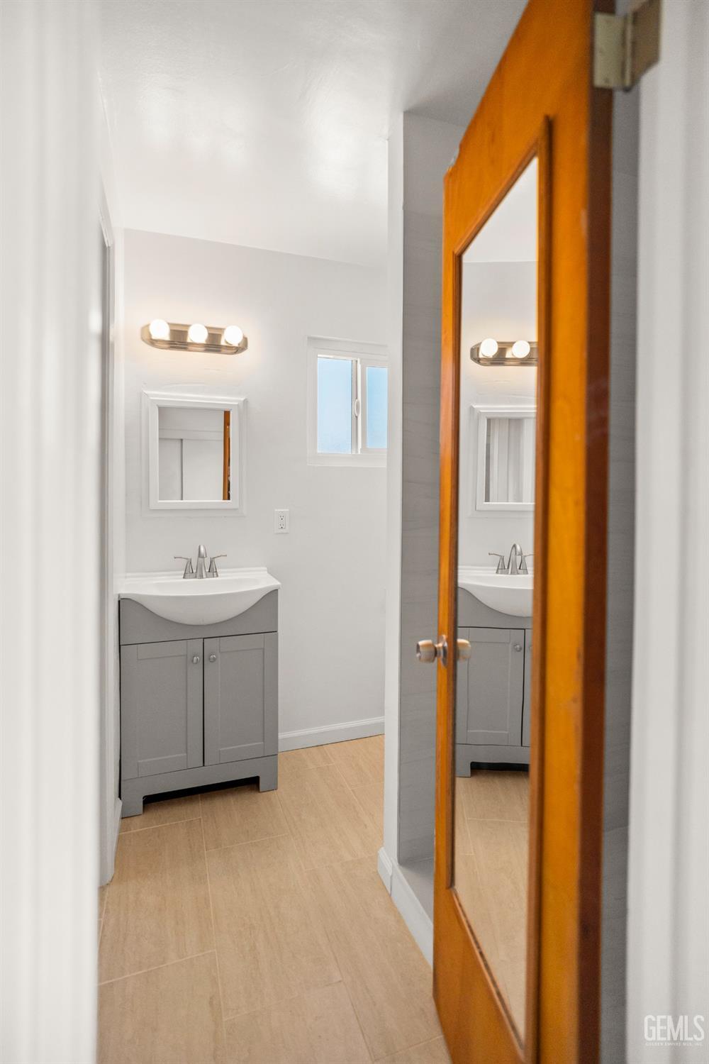 Undisclosed Address Bakersfield, CA 93304 - Photo 27 of 41 a bathroom with a sink and a mirror