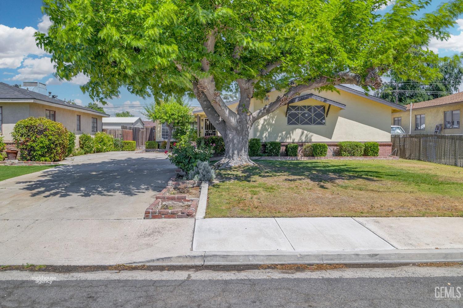 Undisclosed Address Bakersfield, CA 93304 - Photo 3 of 41 a view of a yard in front of a house