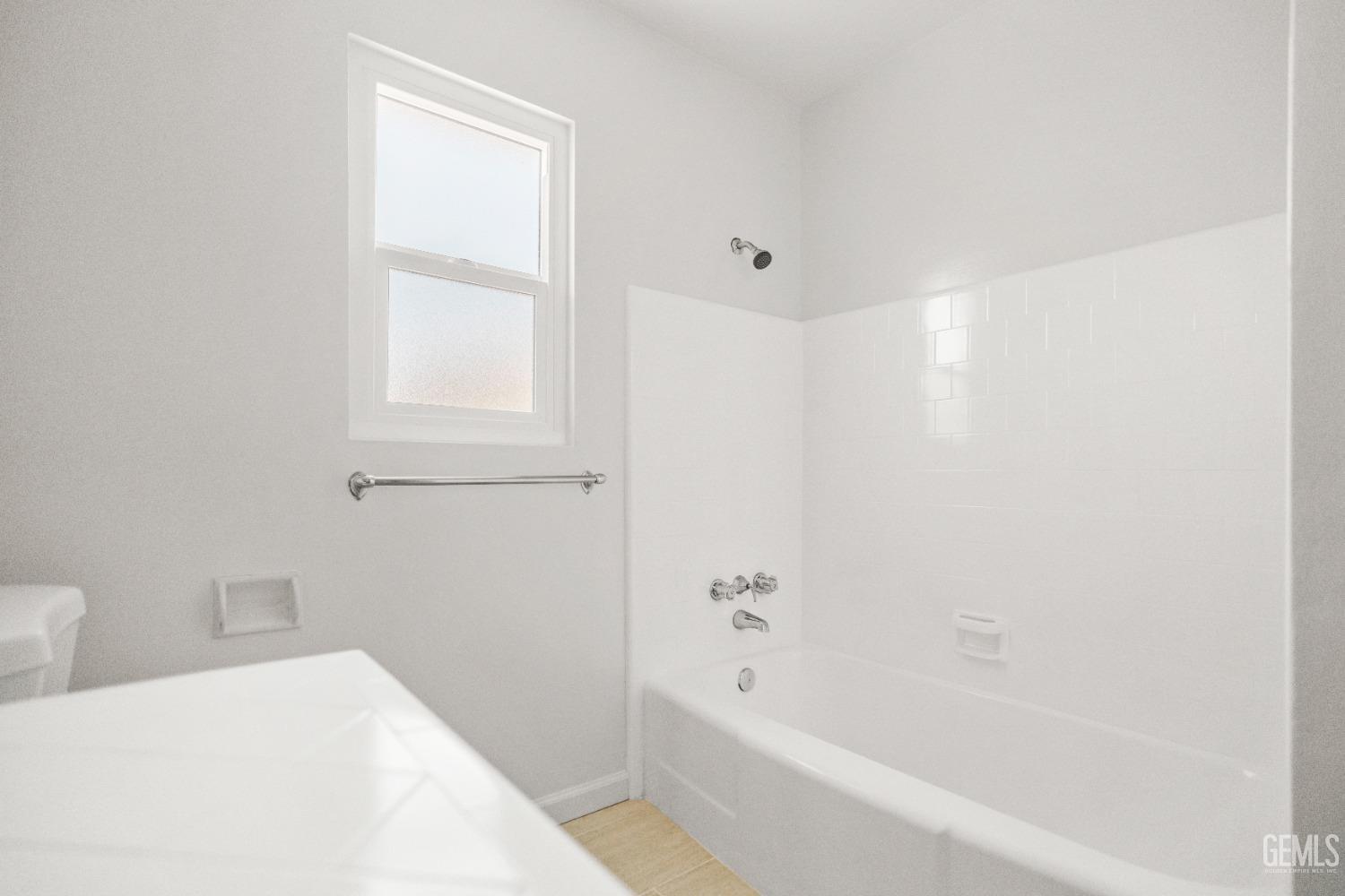 Undisclosed Address Bakersfield, CA 93304 - Photo 31 of 41 a bathroom with a bathtub and a toilet