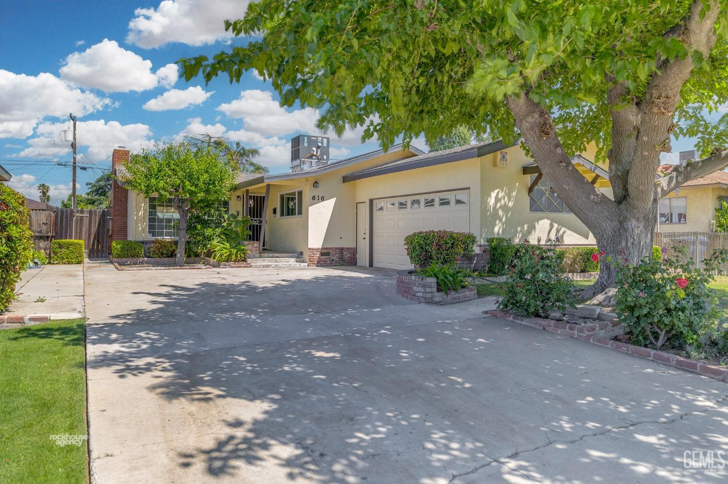 Undisclosed Address Bakersfield, CA 93304 - Photo 4 of 41 a view of a house with backyard and a garden