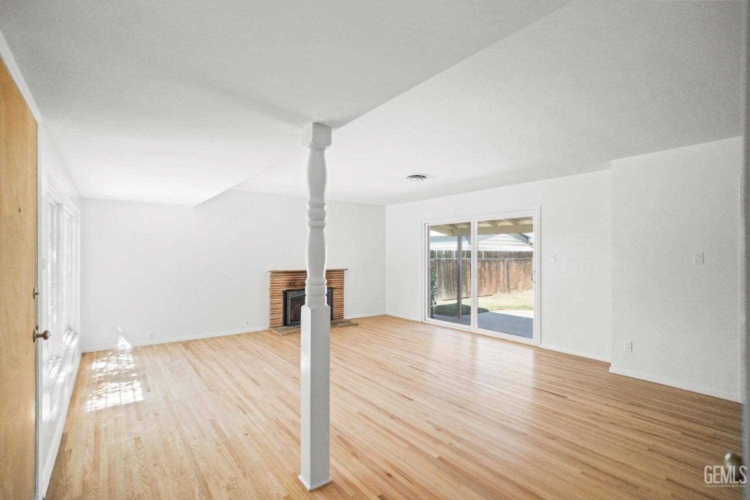 Undisclosed Address Bakersfield, CA 93304 - Photo 9 of 41 wooden floor in an empty room with a window