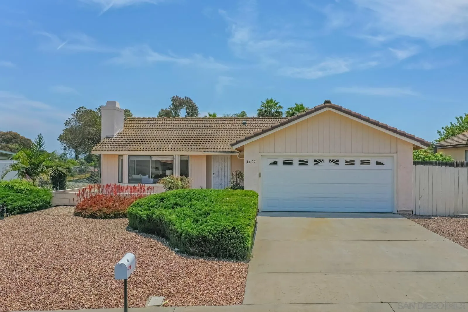 4607 Briar Ridge Road Oceanside, CA 92056 - Photo 2 of 32 a view of a house with a yard and plants