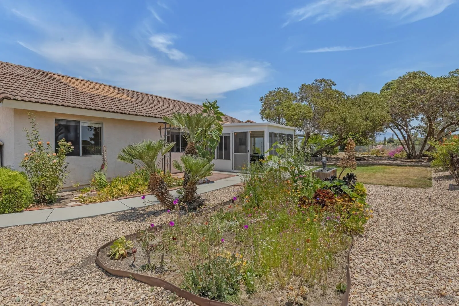 4607 Briar Ridge Road Oceanside, CA 92056 - Photo 26 of 32 front view of a house with a yard