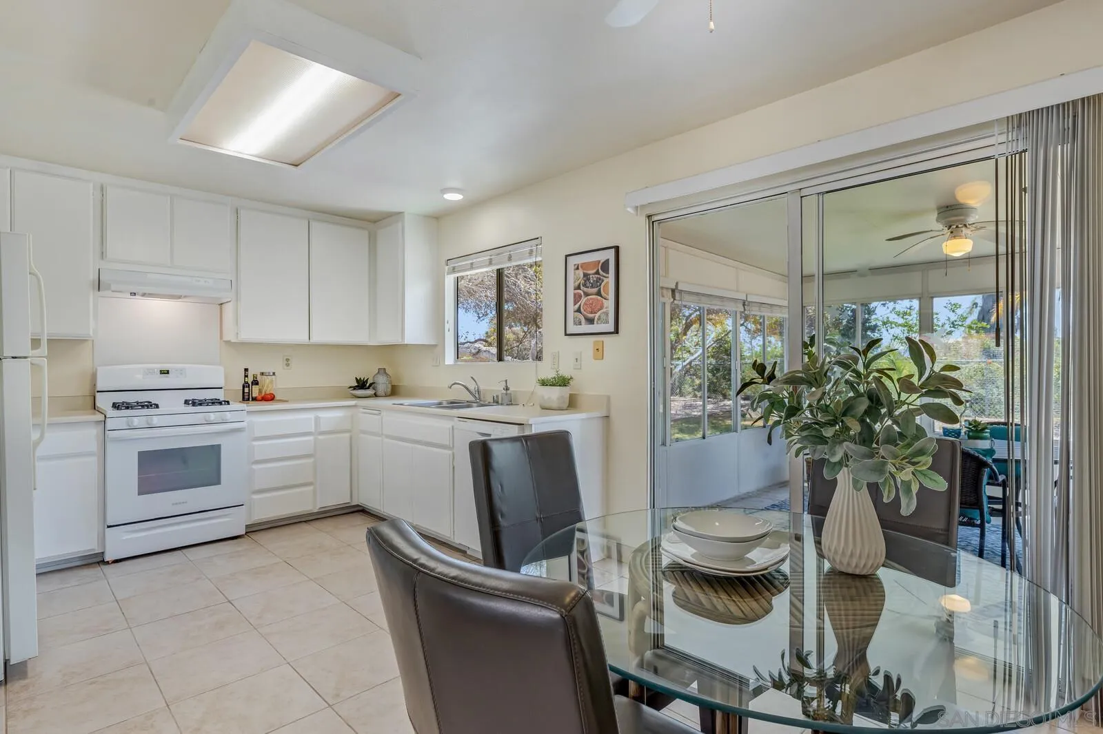 4607 Briar Ridge Road Oceanside, CA 92056 - Photo 9 of 32 a kitchen with a refrigerator and a stove