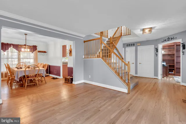 a view of a livingroom with furniture and hardwood floor