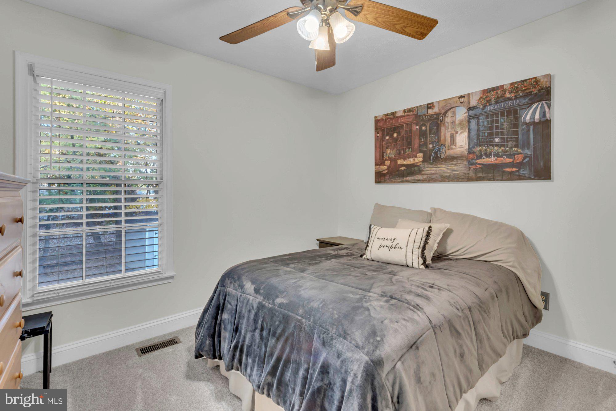 604 Academy Avenue Owings Mills, MD 21117 - Photo 24 of 51 a bedroom with a bed and a window
