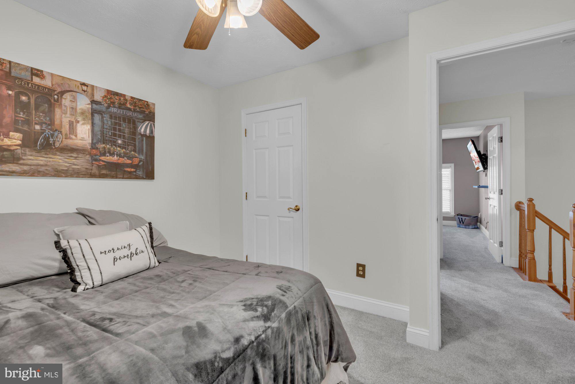 604 Academy Avenue Owings Mills, MD 21117 - Photo 25 of 51 a bedroom with a bed and a painting on the wall